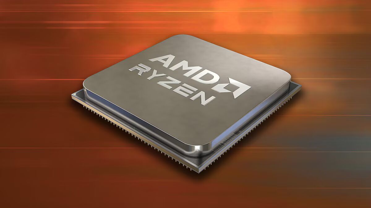 Un processeur AMD Ryzen posé sur un fond orange texturé.