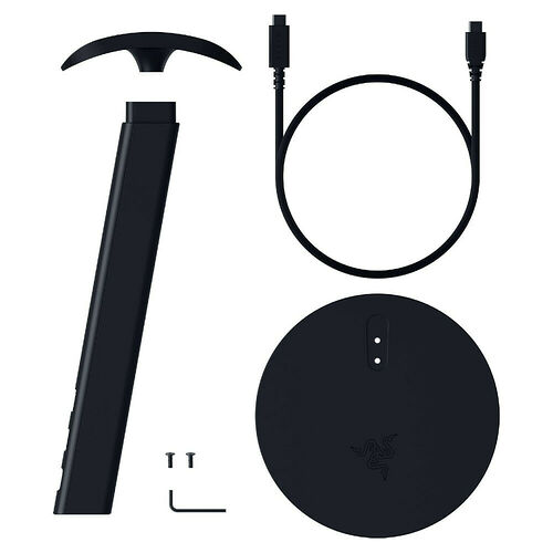 Accessoire de recharge Razer comprenant une base de charge circulaire, un câble USB et une tige de support noire.