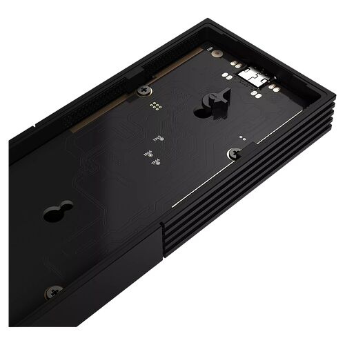 Vue de l'arrière d'un composant électronique noir avec des circuits imprimés et des points de fixation visibles.