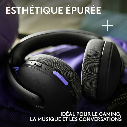 Casque audio noir avec coussinets en tissu gris, présenté sur un fond violet. Le design est épuré avec des touches de violet sur les boutons de contrôle.