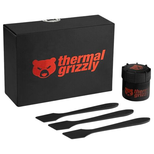Kit de pâte thermique Thermal Grizzly comprenant une boîte noire, un petit pot de pâte et trois spatules d'application noires.