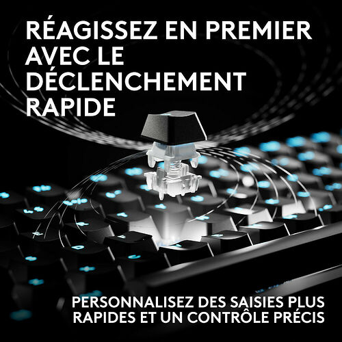 Image d'un clavier mécanique avec un switch mis en avant pour illustrer la technologie de déclenchement rapide. Le clavier est rétroéclairé de bleu sur fond noir.