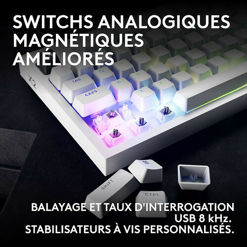 Clavier mécanique blanc avec touches détachables, mettant en avant ses switches magnétiques analogiques et son rétroéclairage RGB. Le texte indique un taux d'interrogation USB de 8 kHz et des stabilisateurs personnalisés.