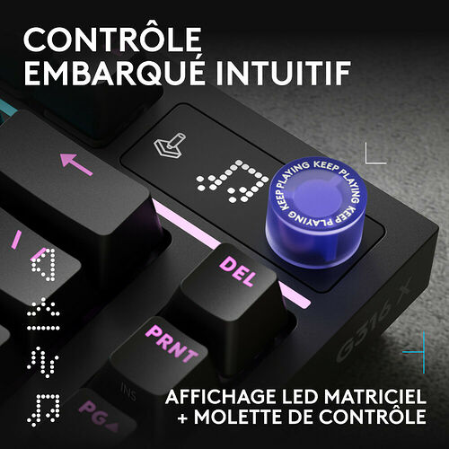 Clavier mécanique noir avec un affichage LED matriciel et une molette de contrôle bleue marquée "Keep Playing". On aperçoit également les touches DEL et PRNT.