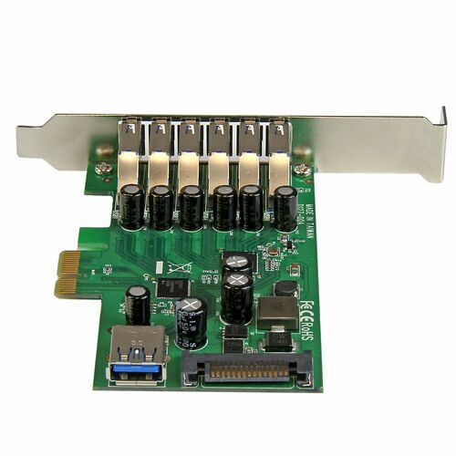 Carte d'extension PCIe avec six ports USB argentés et un port USB-C sur une plaque de circuit imprimé verte.