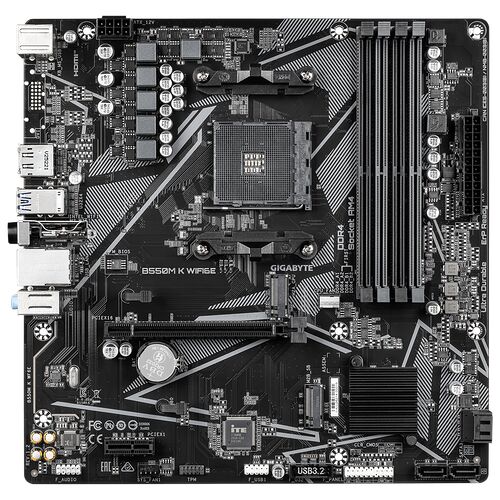 Carte mère Gigabyte B550M K WIFI avec socket AM4, emplacements mémoire DDR4 et connecteurs divers sur un circuit imprimé noir.