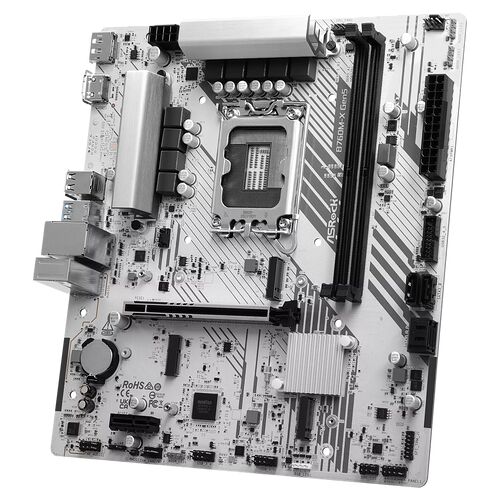 Carte mère ASRock avec socket CPU, emplacements de mémoire RAM et connecteurs divers, présentée en noir et blanc.