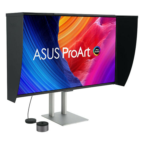 Écran ASUS ProArt OLED avec un design ultra-large et des côtés noirs protecteurs, monté sur un pied métallique argenté.