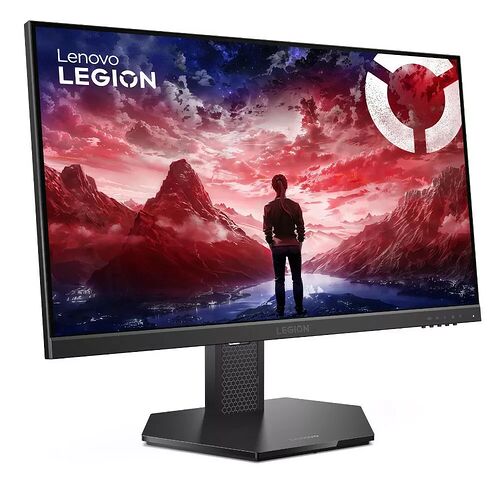Écran de PC gamer Lenovo Legion affichant un paysage montagneux spectaculaire sous un ciel rouge et violet. L'écran est monté sur un pied noir robuste avec le logo Legion visible sur la base.