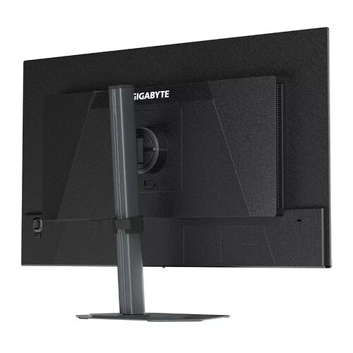 Écran de PC Gigabyte vu de l'arrière, montrant le pied de support noir et le logo de la marque.