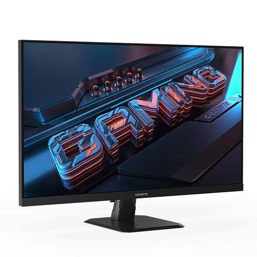 Écran de PC gamer Gigabyte avec un design fin et un pied de support noir. L'écran affiche un fond d'écran graphique avec des lettres lumineuses en 3D.