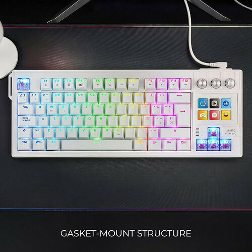 Clavier mécanique compact blanc avec rétroéclairage RGB multicolore, présenté avec une structure de montage gasket.