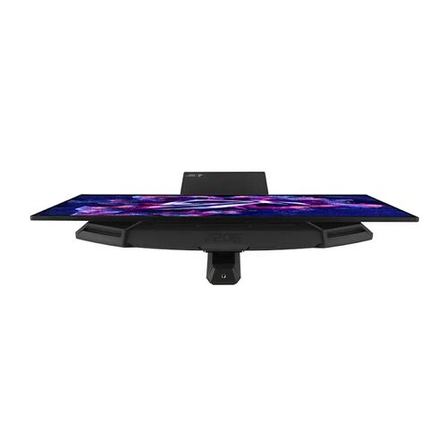 Écran de PC ultra-large avec un design fin et un support central, affichant un fond d'écran coloré et dynamique.