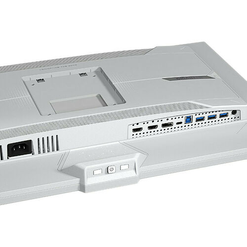 Arrière d'un PC compact de marque Gigabyte, montrant les ports de connexion USB, HDMI et les fentes d'aération sur un boîtier blanc.