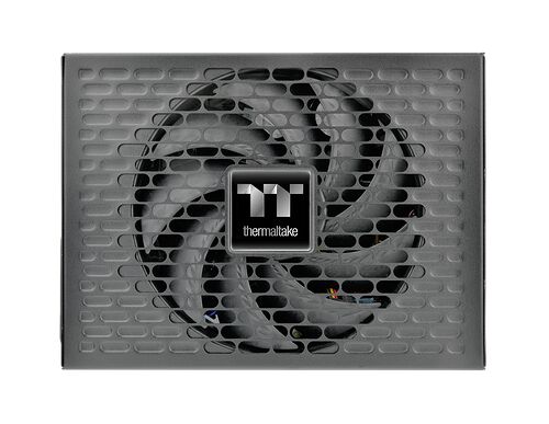 Bloc d'alimentation Thermaltake avec un ventilateur central protégé par une grille métallique grise.