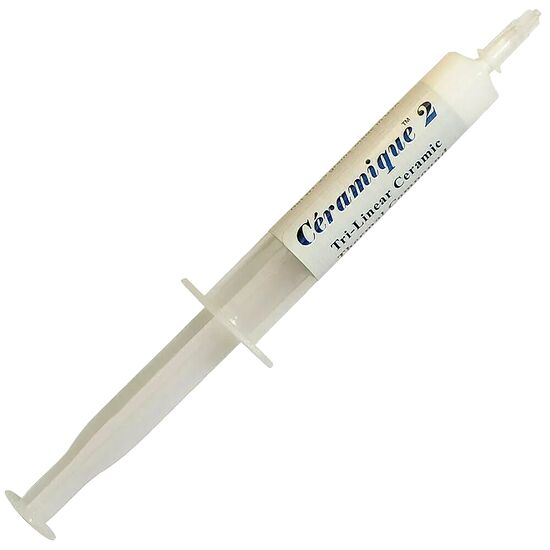 Pâte thermique Céramique 2 présentée dans un tube blanc pour l'application sur les processeurs.
