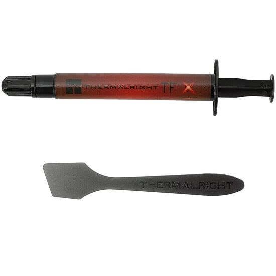 Une seringue de pâte thermique Thermalright TF9 et une spatule de l'étalage de la même marque sur fond blanc.