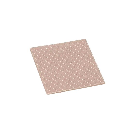 Une plaque métallique carrée avec un motif en relief de type diamant, de couleur cuivre ou bronze.