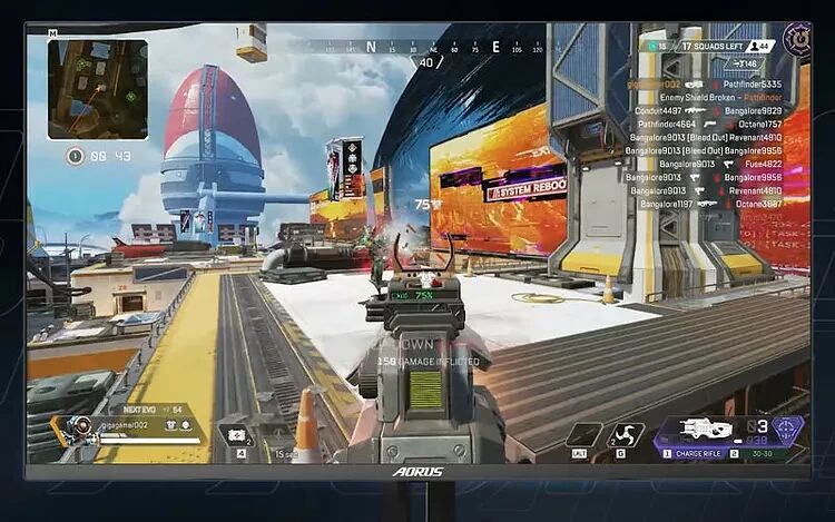 Capture d'écran d'un jeu de tir à la première personne sur un écran Aorus, montrant une vue de combat dans un environnement urbain futuriste.