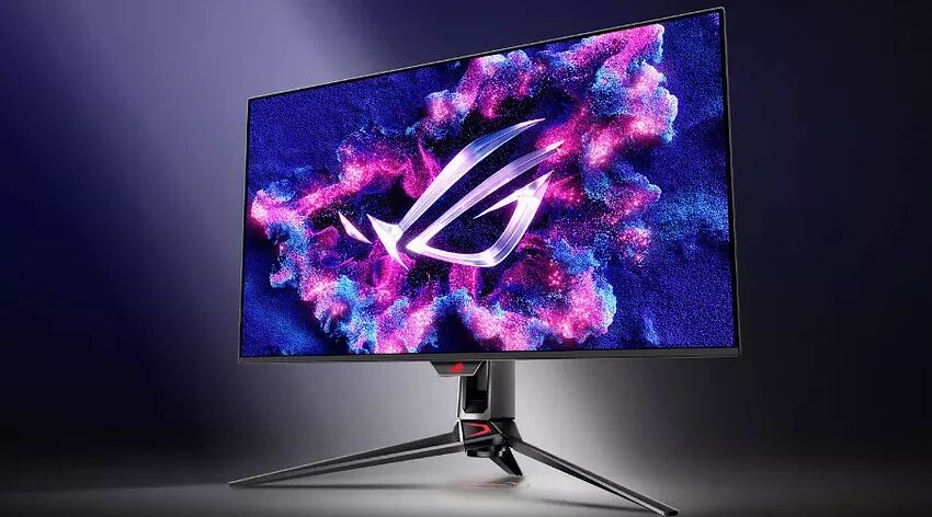 Écran de PC gamer ASUS avec un fond d'écran abstrait bleu et rose affichant le logo ROG. L'écran est monté sur un pied trépied noir.