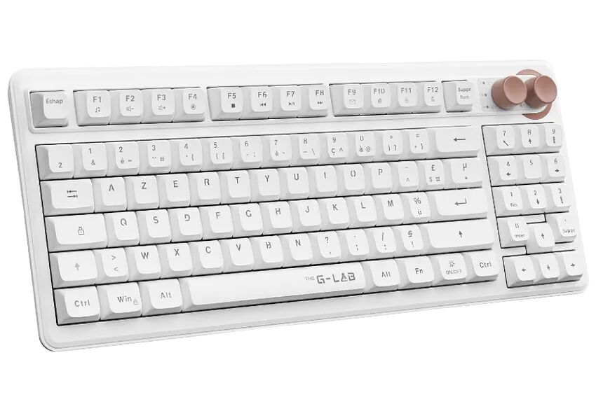 Clavier mécanique blanc de la marque G-LAB avec des touches de couleur beige et des boutons de réglage sur le côté supérieur droit.