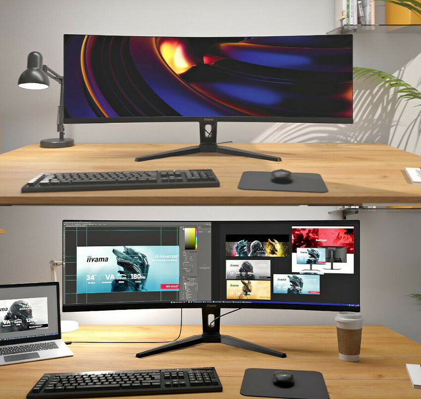 Écran ultra-large iiyama affichant un fond d'écran coloré sur un bureau avec clavier et souris.