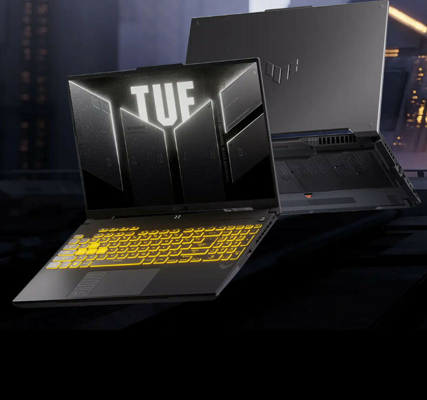 Ordinateur portable ASUS TUF avec un clavier rétroéclairé jaune et un écran affichant le logo TUF sur un fond sombre.