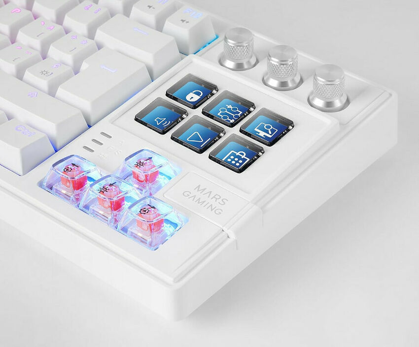 Clavier mécanique blanc Mars Gaming avec touches personnalisables et boutons de contrôle multimédia rétroéclairés. On aperçoit également des commutateurs mécaniques transparents avec des ressorts rouges.