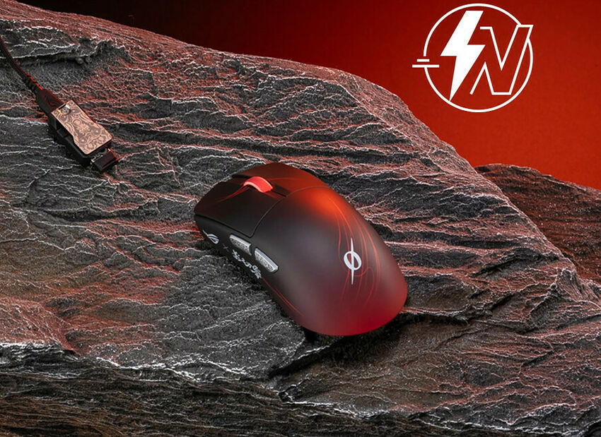 Souris gaming ASUS noire avec des accents rouges et un éclairage LED, posée sur une surface rocheuse texturée.